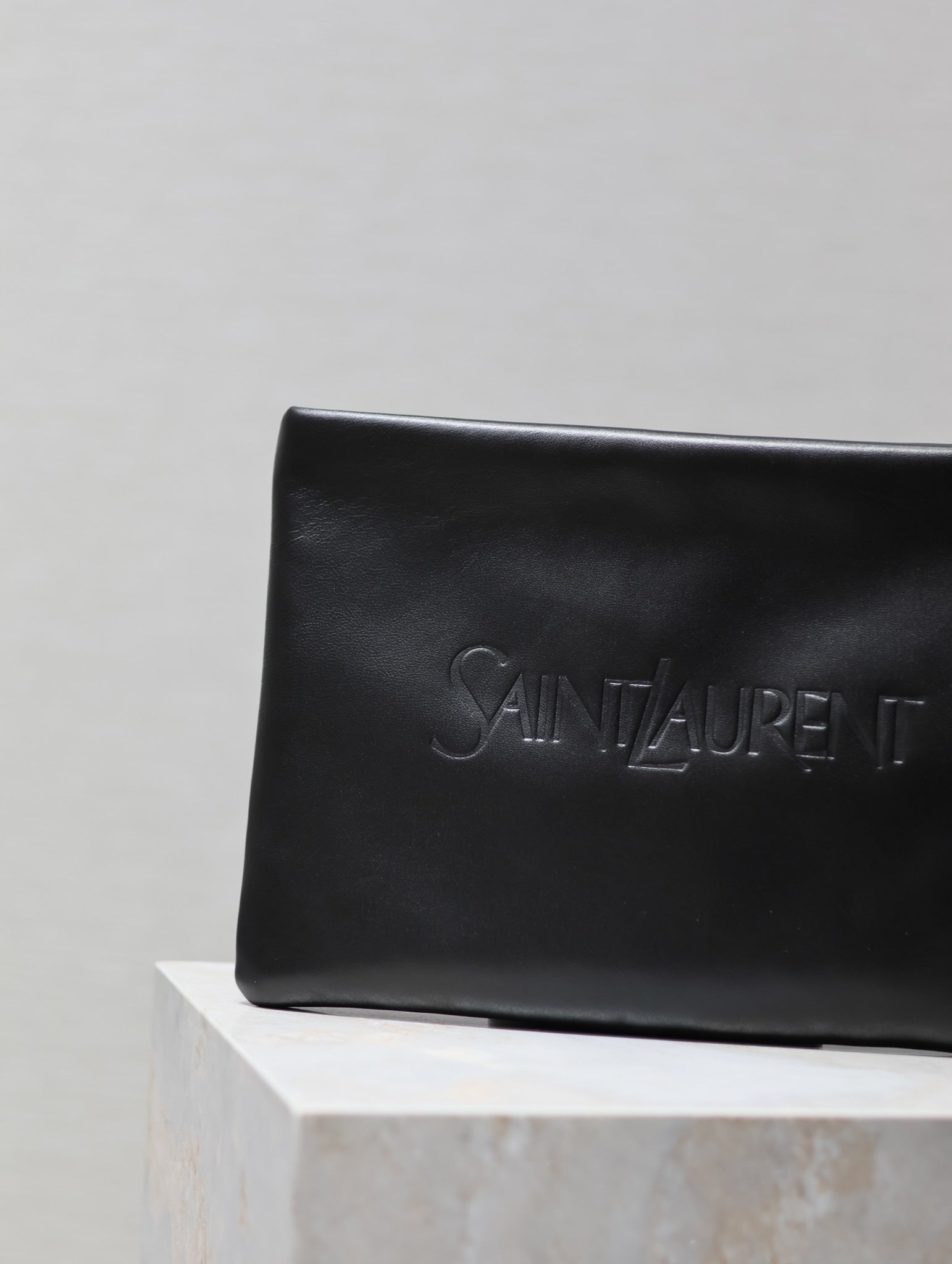 SAINT LAURENT POUCH 30 IN BLACK CALFSKIN WITH EMBOSSED LOGO