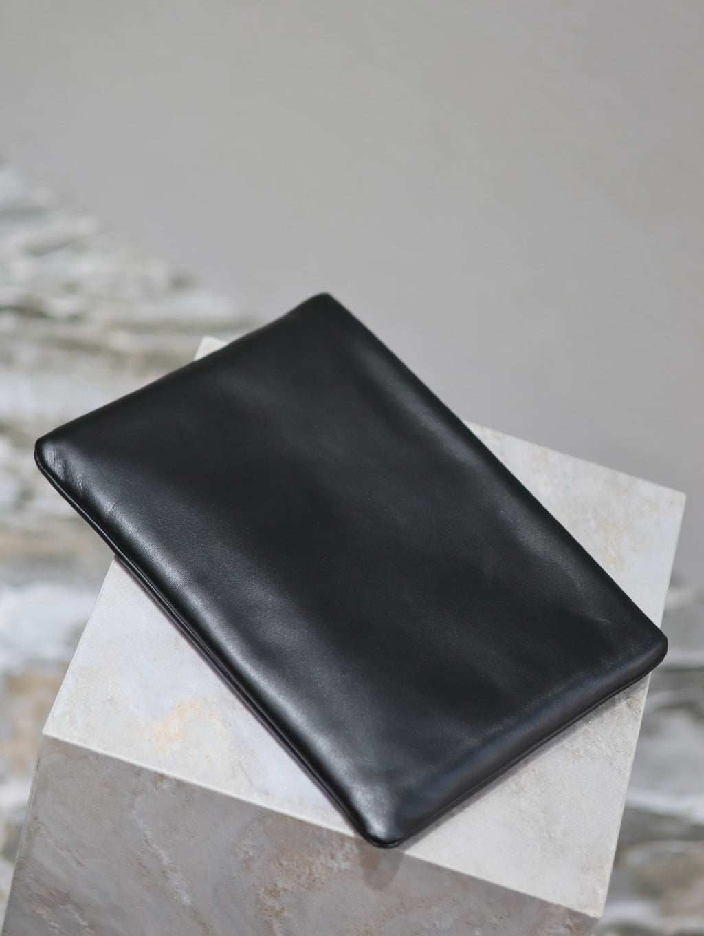 SAINT LAURENT POUCH 30 IN BLACK CALFSKIN WITH EMBOSSED LOGO
