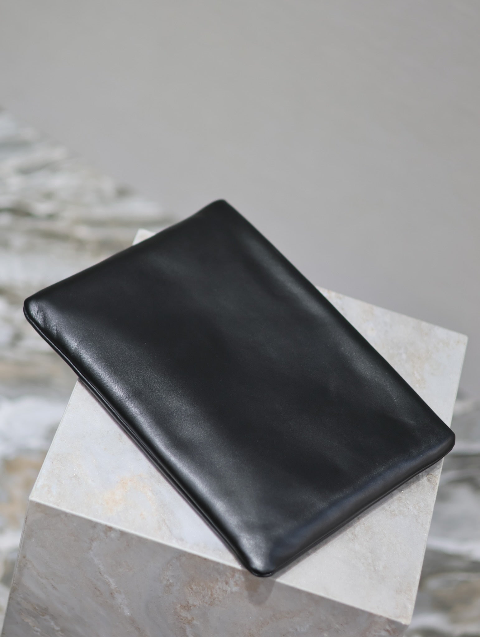 SAINT LAURENT POUCH 30 IN BLACK CALFSKIN WITH EMBOSSED LOGO