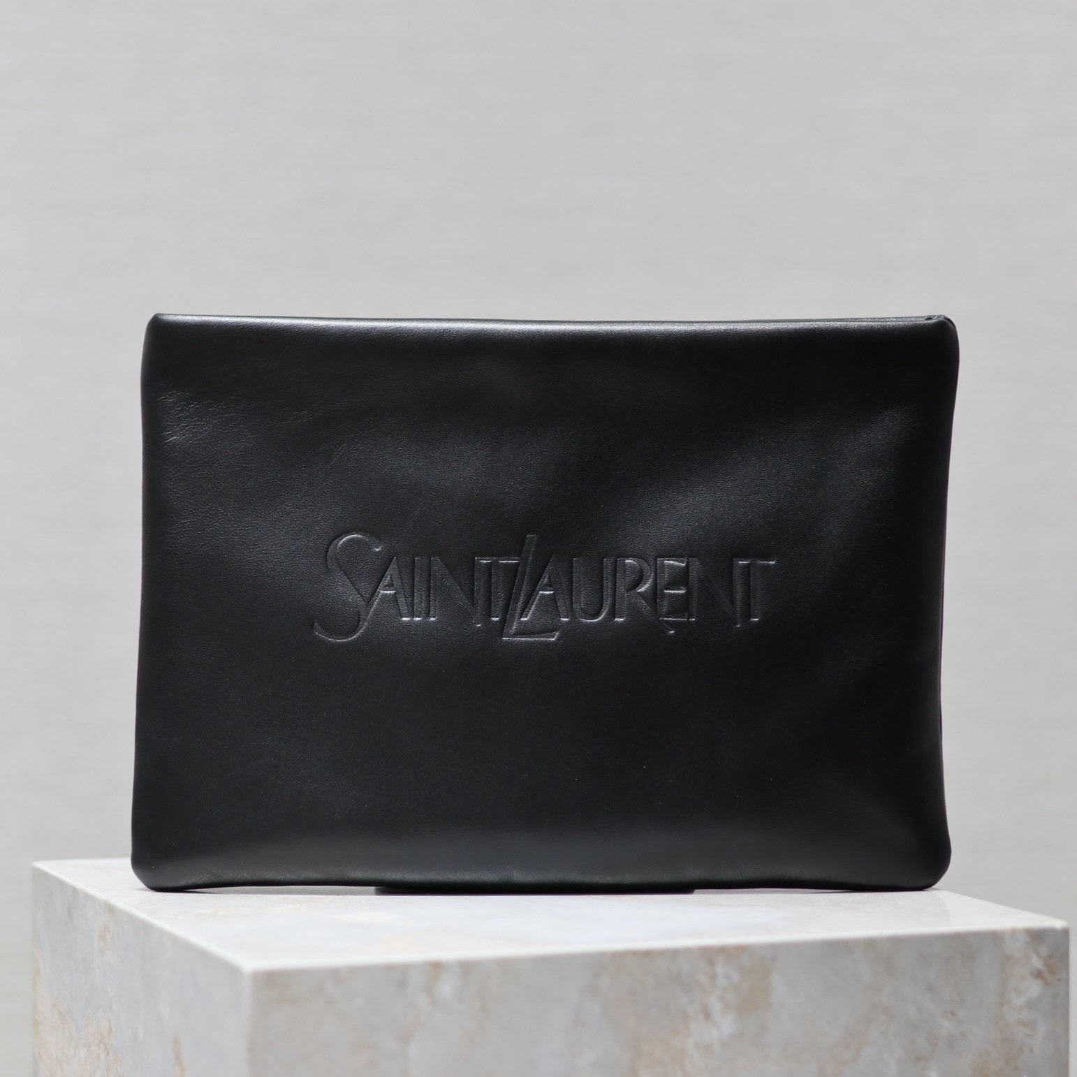 SAINT LAURENT POUCH 30 IN BLACK CALFSKIN WITH EMBOSSED LOGO