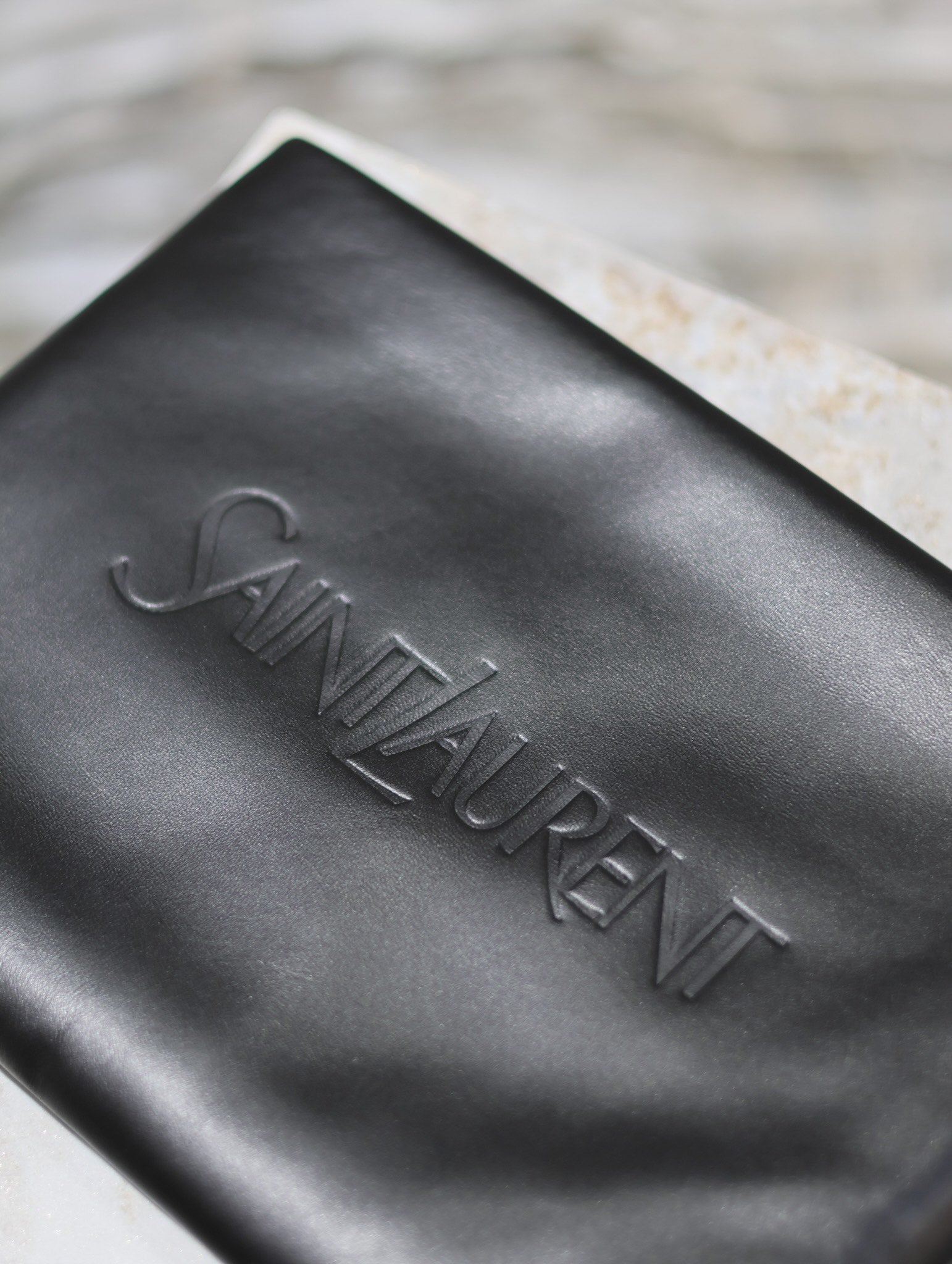 SAINT LAURENT POUCH 30 IN BLACK CALFSKIN WITH EMBOSSED LOGO