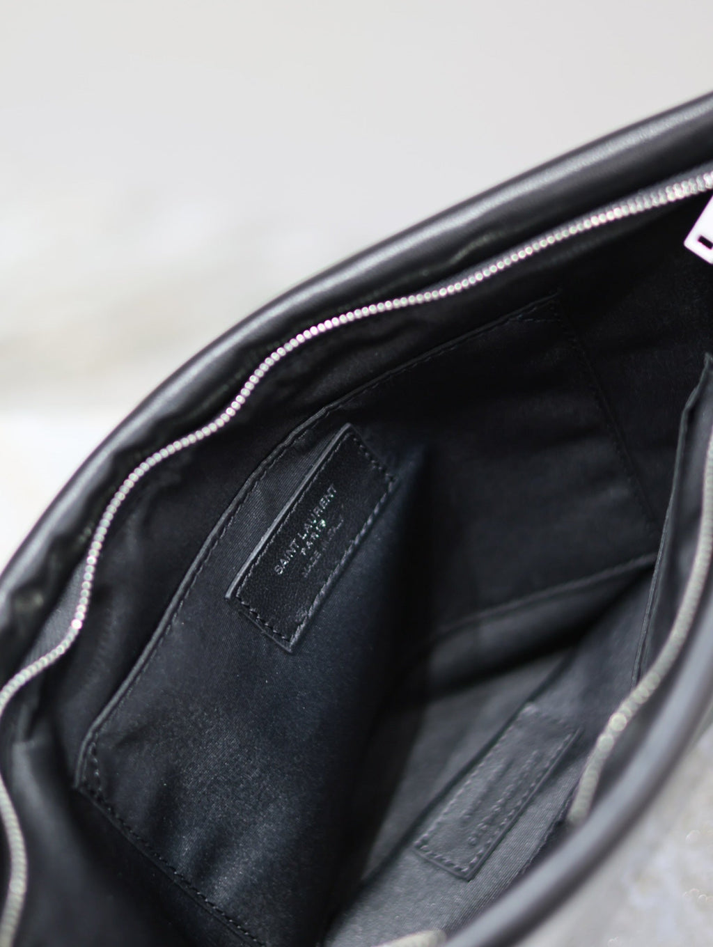 SAINT LAURENT POUCH 30 IN BLACK CALFSKIN WITH EMBOSSED LOGO