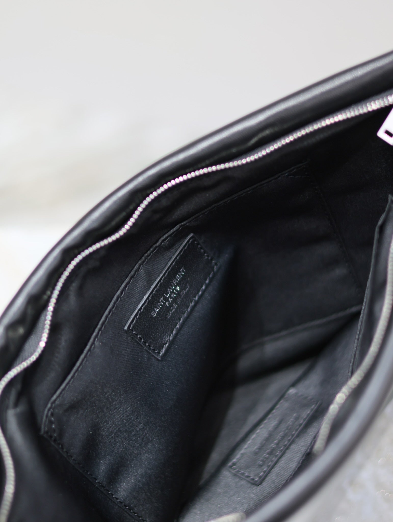 SAINT LAURENT POUCH 30 IN BLACK CALFSKIN WITH EMBOSSED LOGO