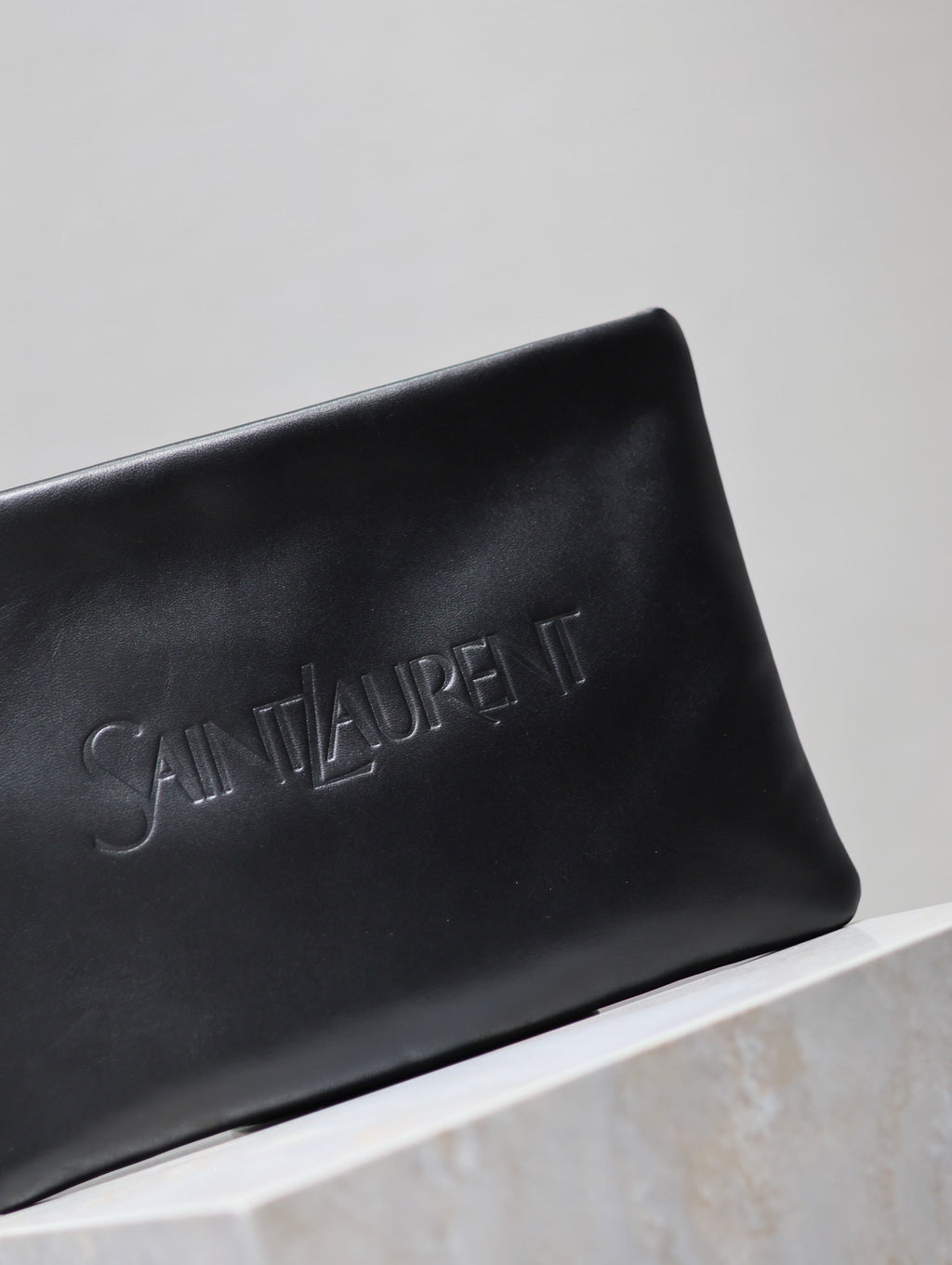 SAINT LAURENT POUCH 30 IN BLACK CALFSKIN WITH EMBOSSED LOGO