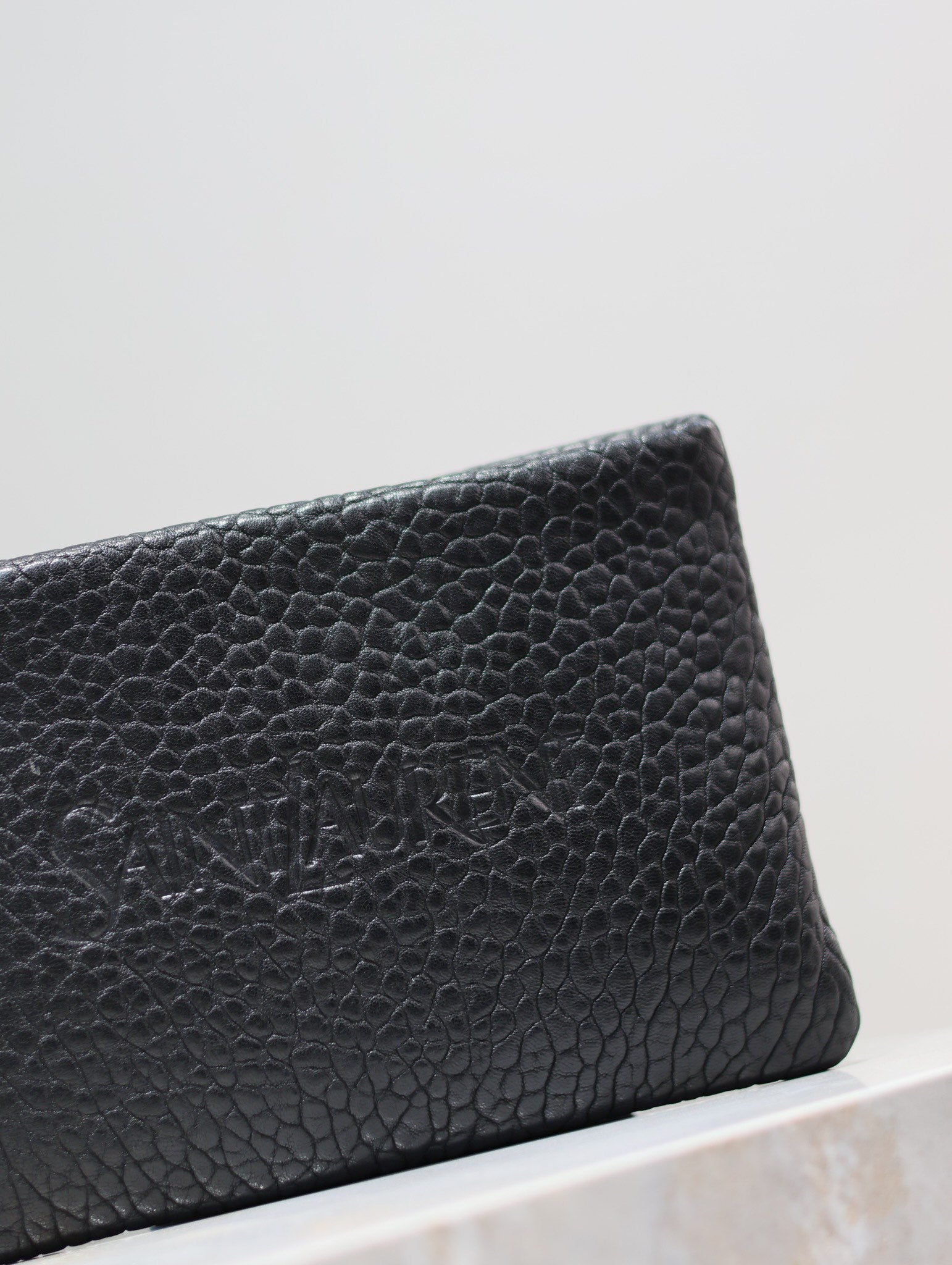 SAINT LAURENT POUCH WITH ELEPHANT TEXTURE 23 IN BLACK LAMBSKIN LOGO EMBOSSED