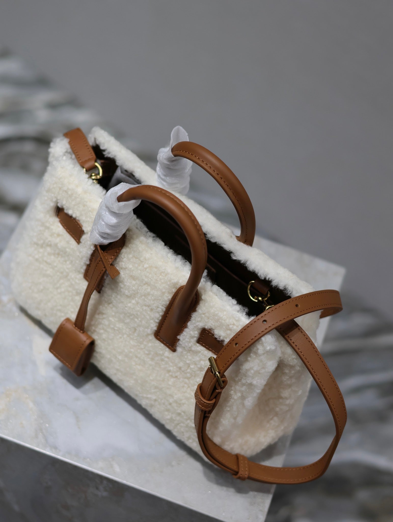 SAINT LAURENT SAC DE JOUR 22 IN WHITE SHEARLING AND BROWN CALFSKIN TRIM