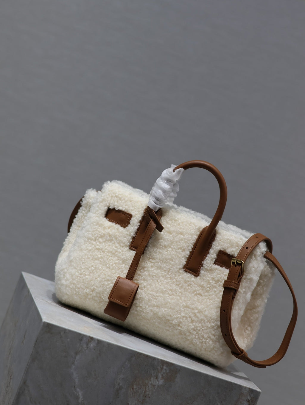 SAINT LAURENT SAC DE JOUR 22 IN WHITE SHEARLING AND BROWN CALFSKIN TRIM