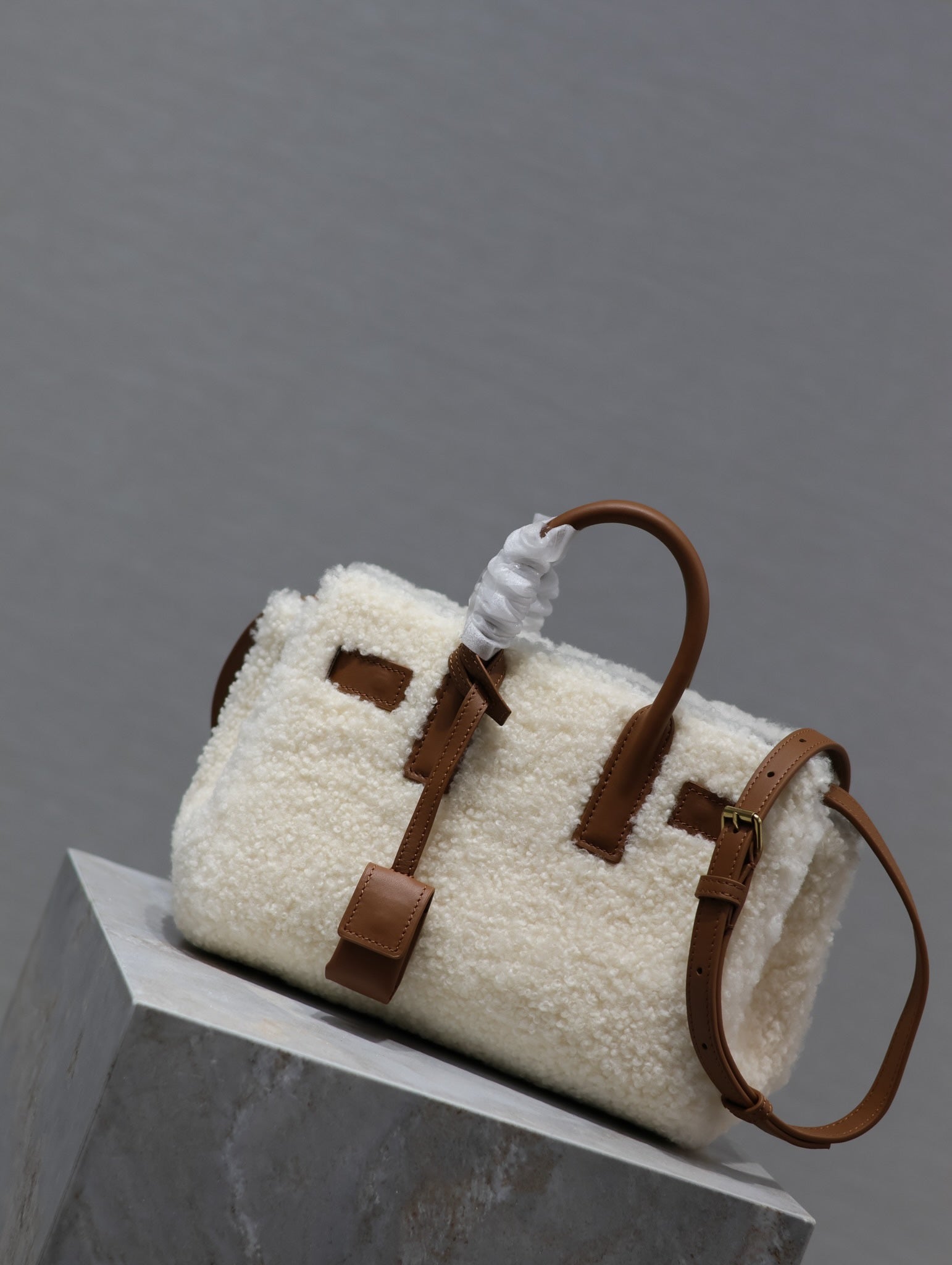 SAINT LAURENT SAC DE JOUR 22 IN WHITE SHEARLING AND BROWN CALFSKIN TRIM
