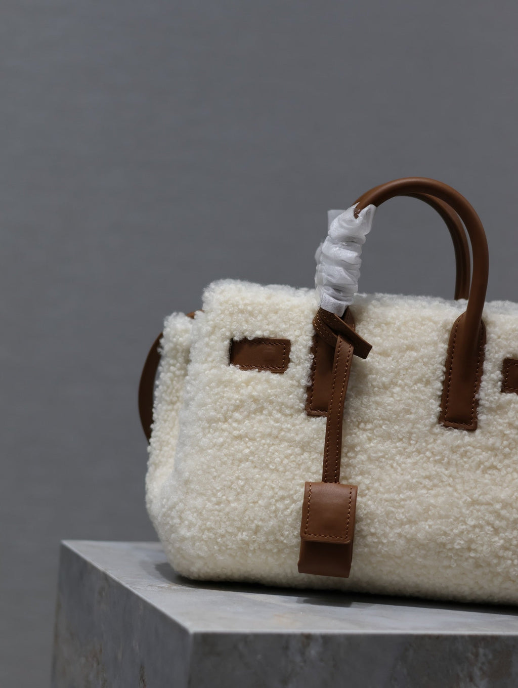 SAINT LAURENT SAC DE JOUR 22 IN WHITE SHEARLING AND BROWN CALFSKIN TRIM