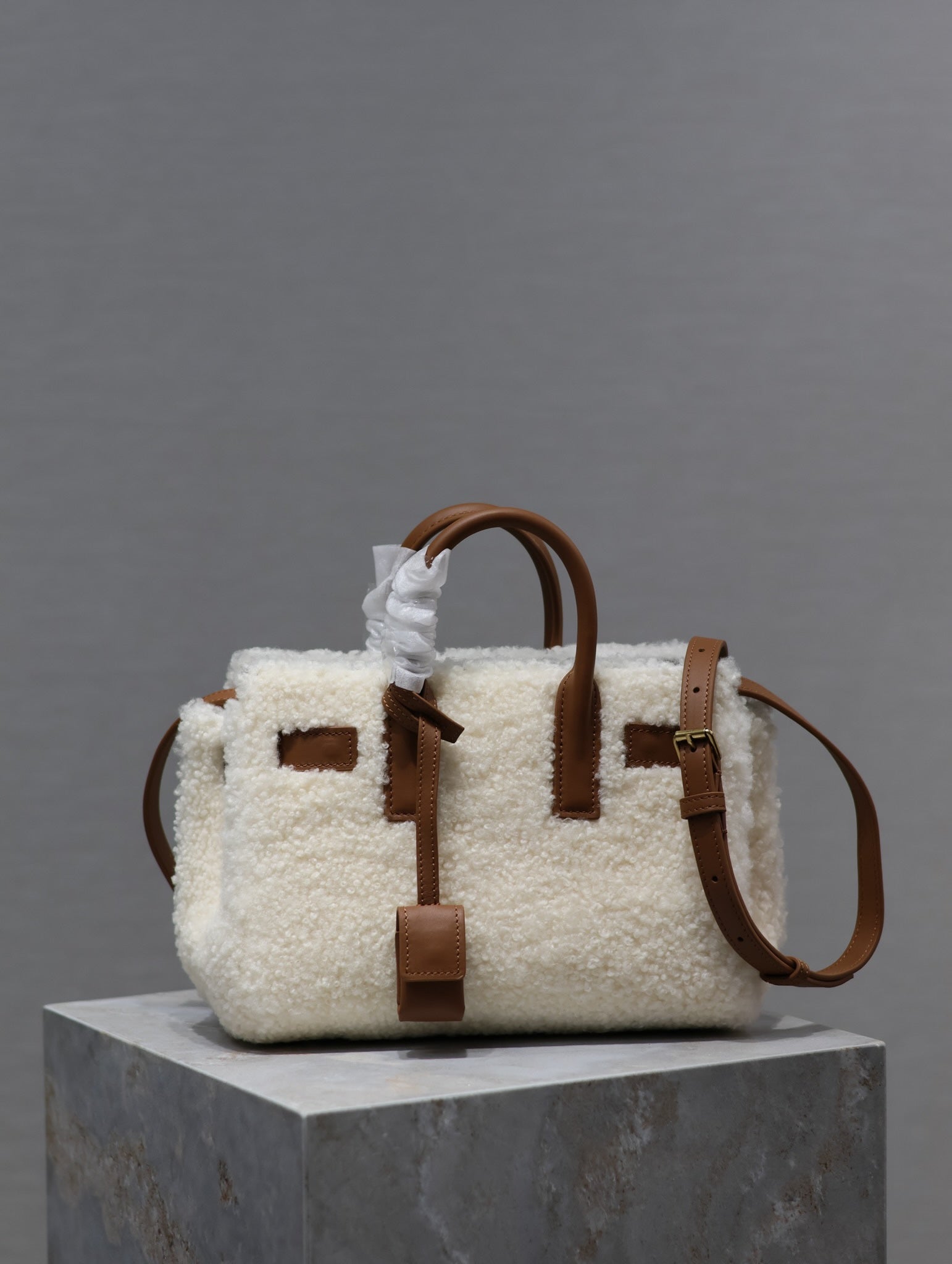 SAINT LAURENT SAC DE JOUR 22 IN WHITE SHEARLING AND BROWN CALFSKIN TRIM