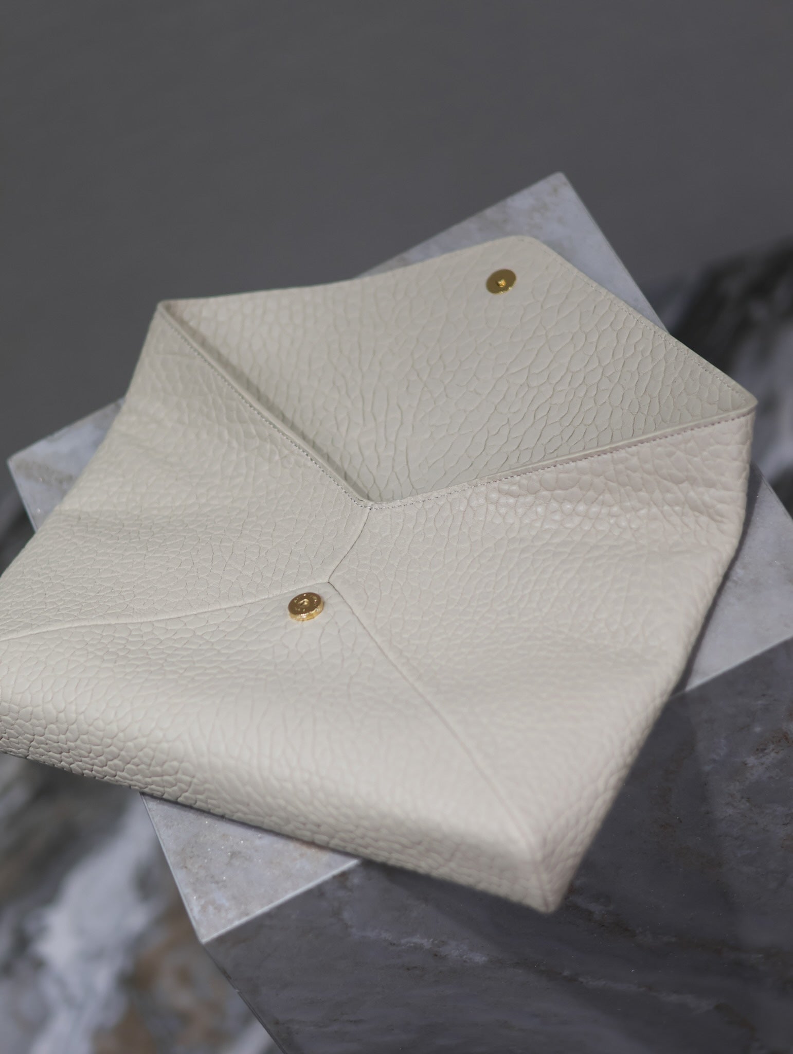 SAINT LAURENT ENVELOPE CLUTCH 29 IN WHITE LAMBSKIN COPPER LOGO