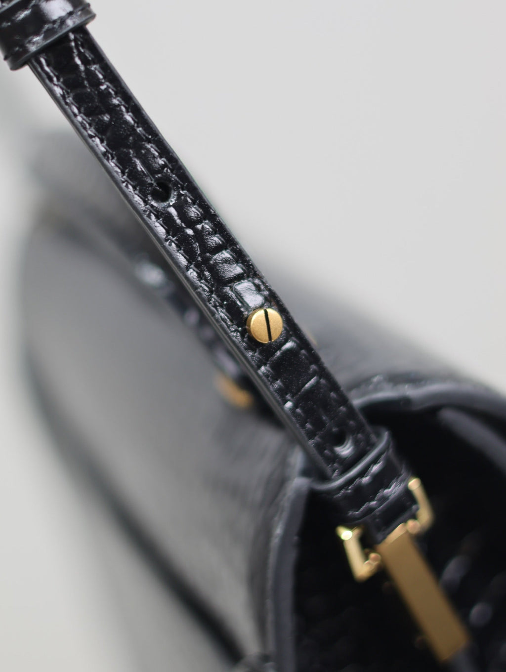 SAINT LAURENT CASSANDRA TOP HANDLE BAG 24 IN BLACK CROCODILE-EMBOSSED GLOSSY CALFSKIN