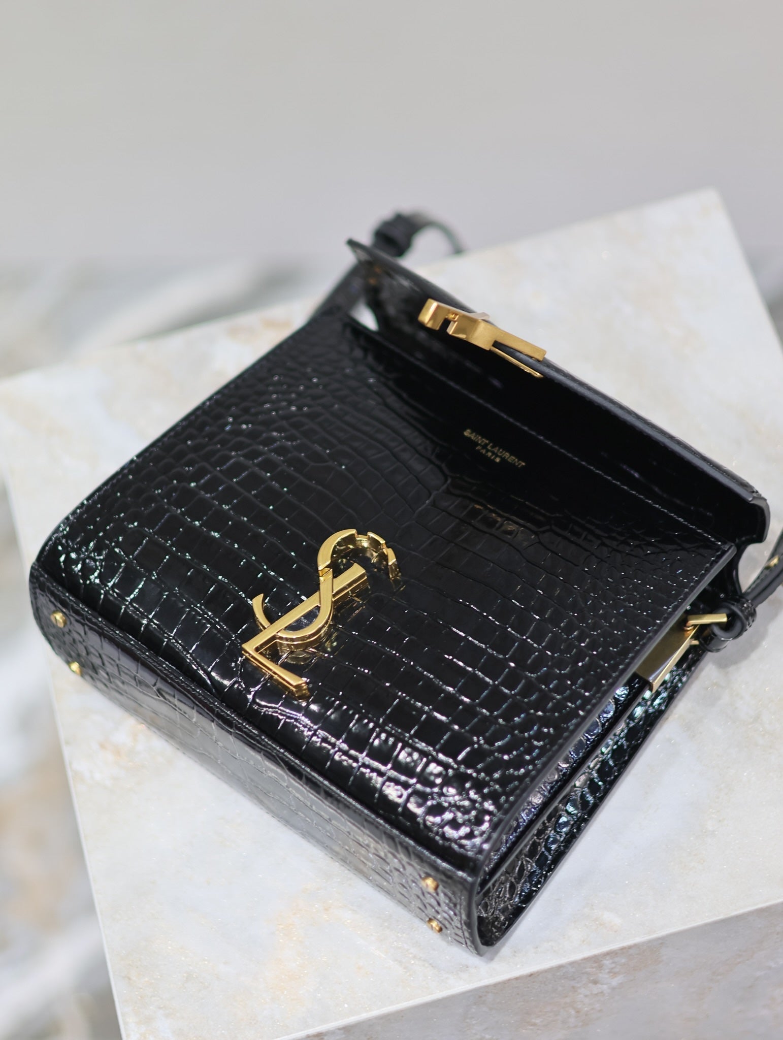 SAINT LAURENT CASSANDRA MINI TOP HANDLE BAG 20 IN BLACK CROCODILE-EMBOSSED GLOSSY CALFSKIN