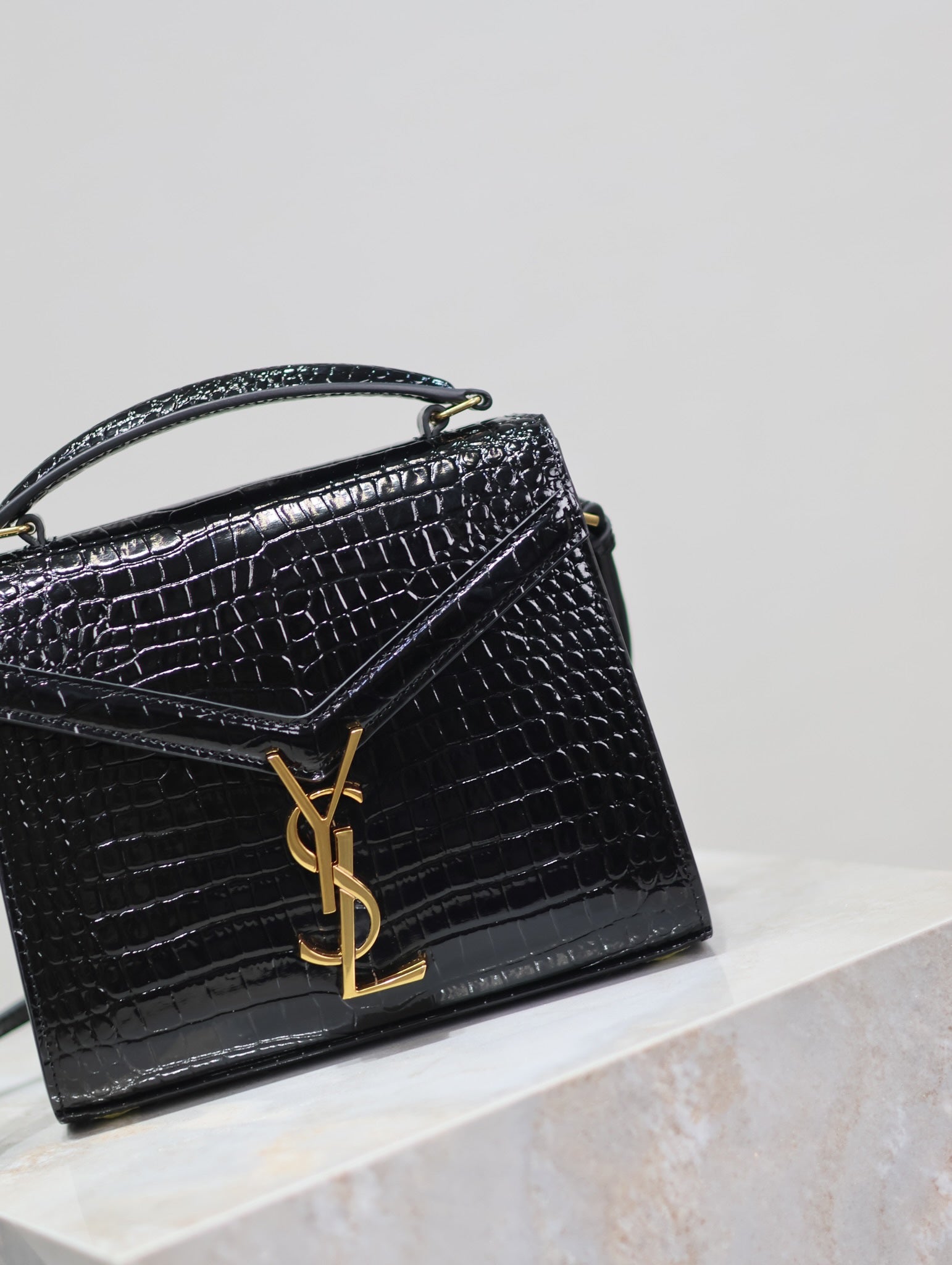 SAINT LAURENT CASSANDRA MINI TOP HANDLE BAG 20 IN BLACK CROCODILE-EMBOSSED GLOSSY CALFSKIN