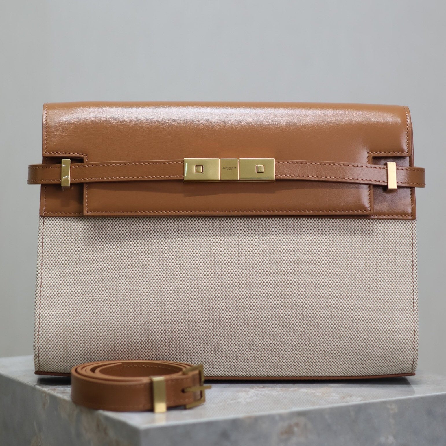 SAINT LAURENT MANHATTAN MEDIUM 29 IN WHITE CANVAS AND BROWN CALFSKIN GOLD BUCKLE