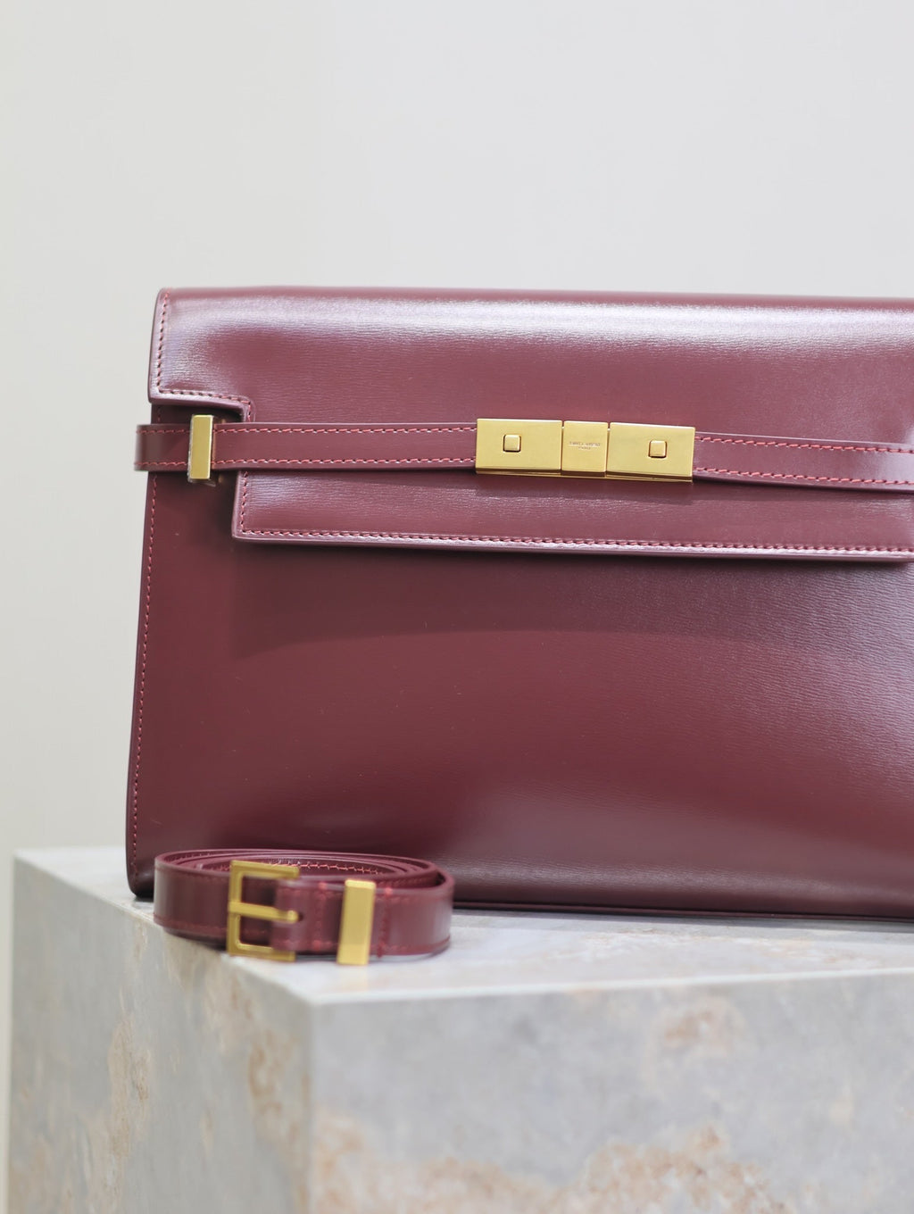 SAINT LAURENT MANHATTAN MEDIUM 29 IN WINE RED SMOOTH CALFSKIN GOLD BUCKLE