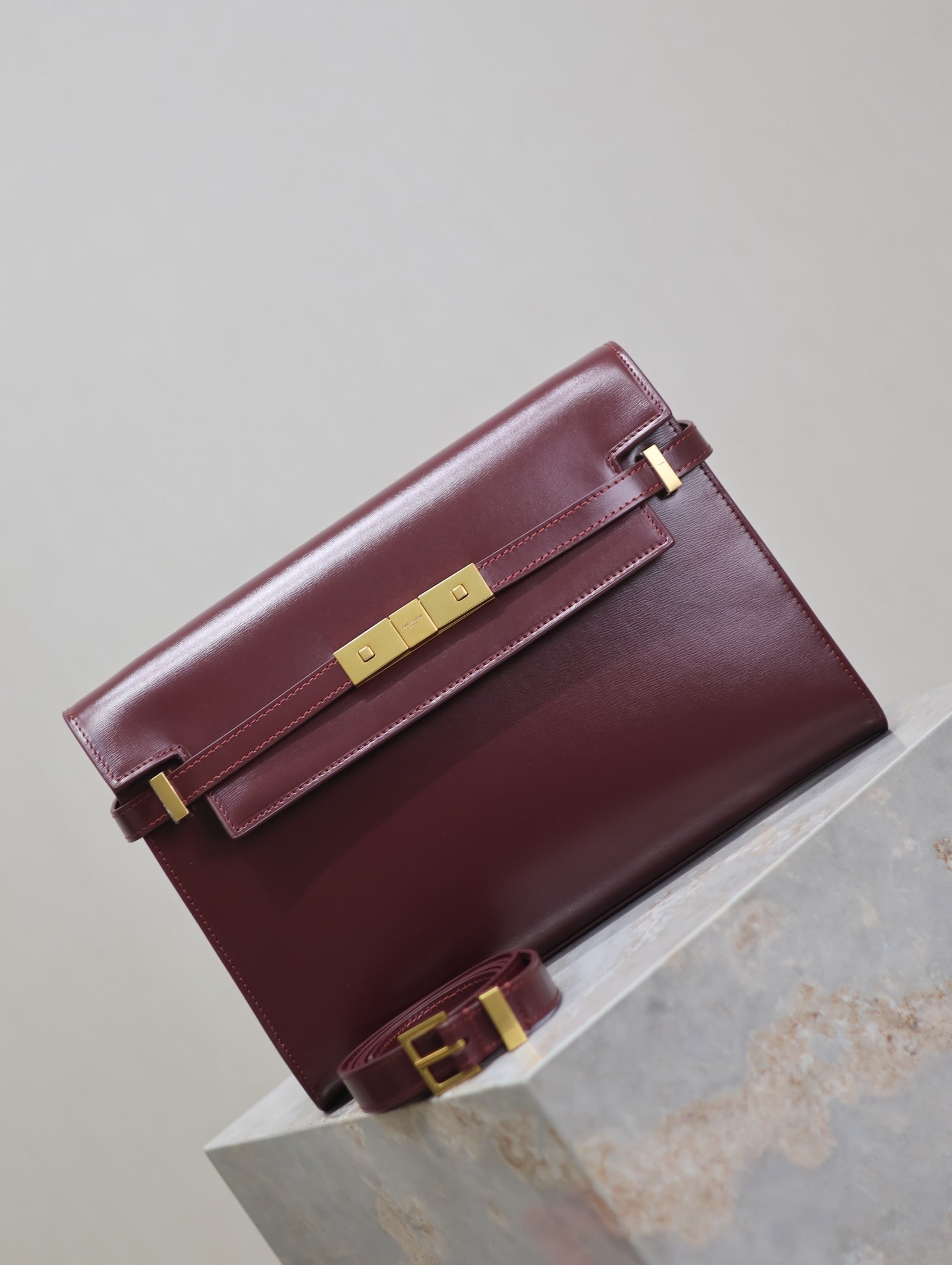 SAINT LAURENT MANHATTAN MEDIUM 29 IN WINE RED SMOOTH CALFSKIN GOLD BUCKLE