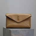 SAINT LAURENT ENVELOPE CLUTCH 29 IN EARTHY YELLOW LAMBSKIN COPPER LOGO
