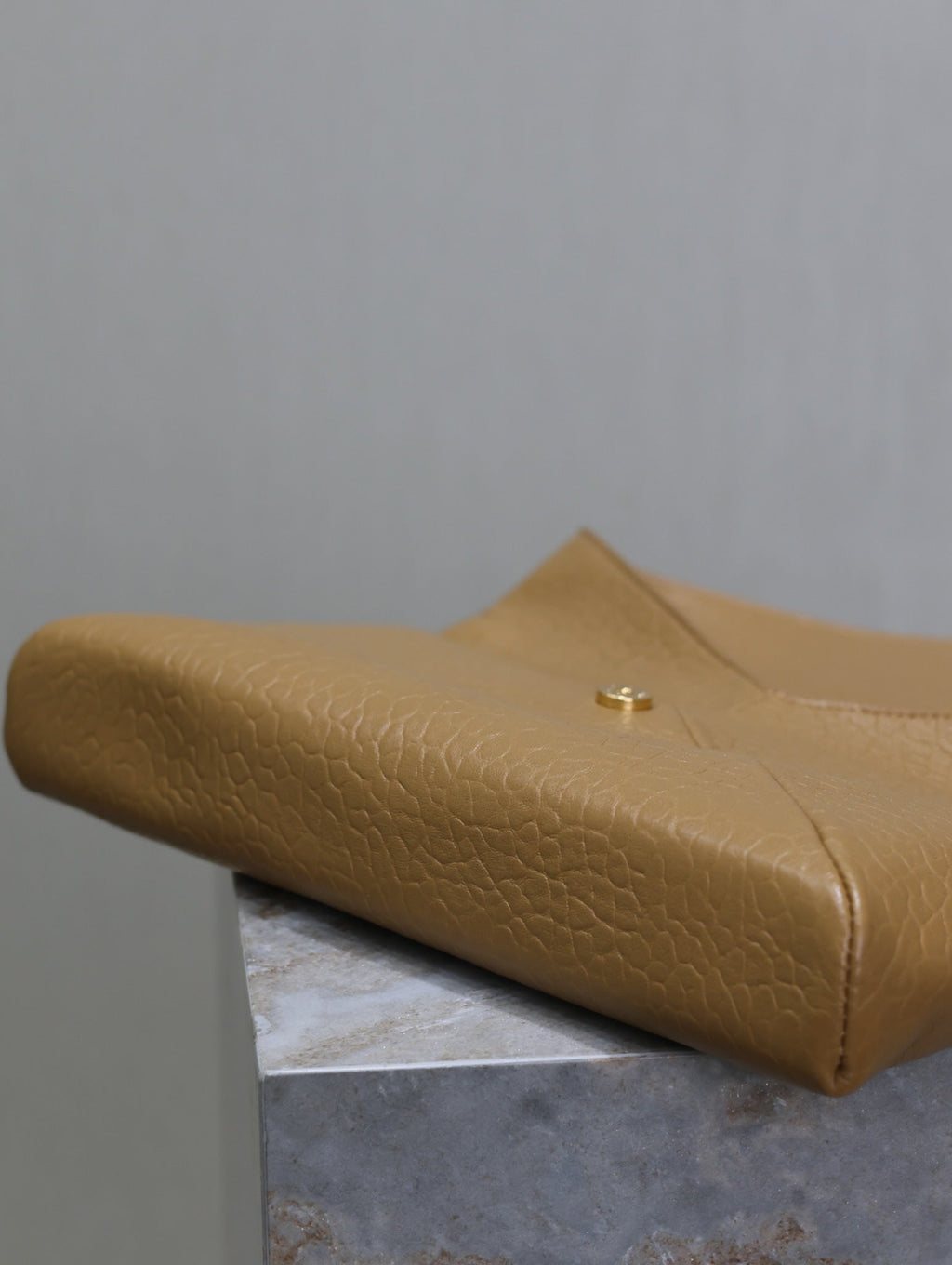 SAINT LAURENT ENVELOPE CLUTCH 29 IN EARTHY YELLOW LAMBSKIN COPPER LOGO
