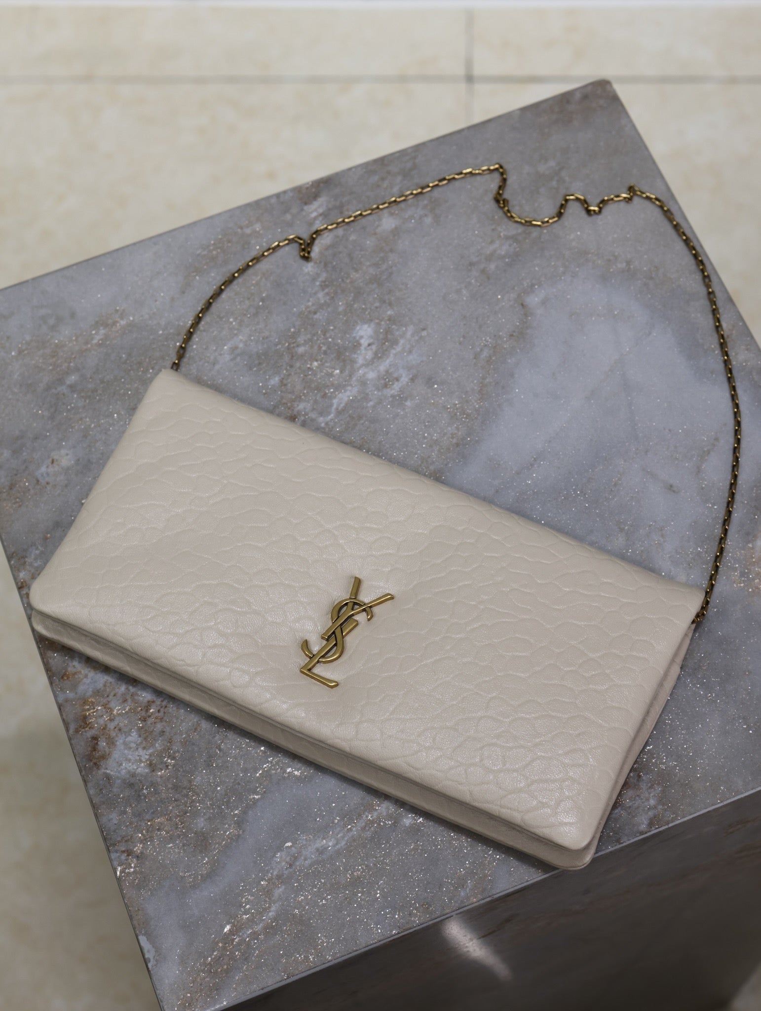 SAINT LAURENT CALYPSO POUCH 24 IN WHITE ELEPHANT TEXTURED LAMBSKIN GOLD LOGO