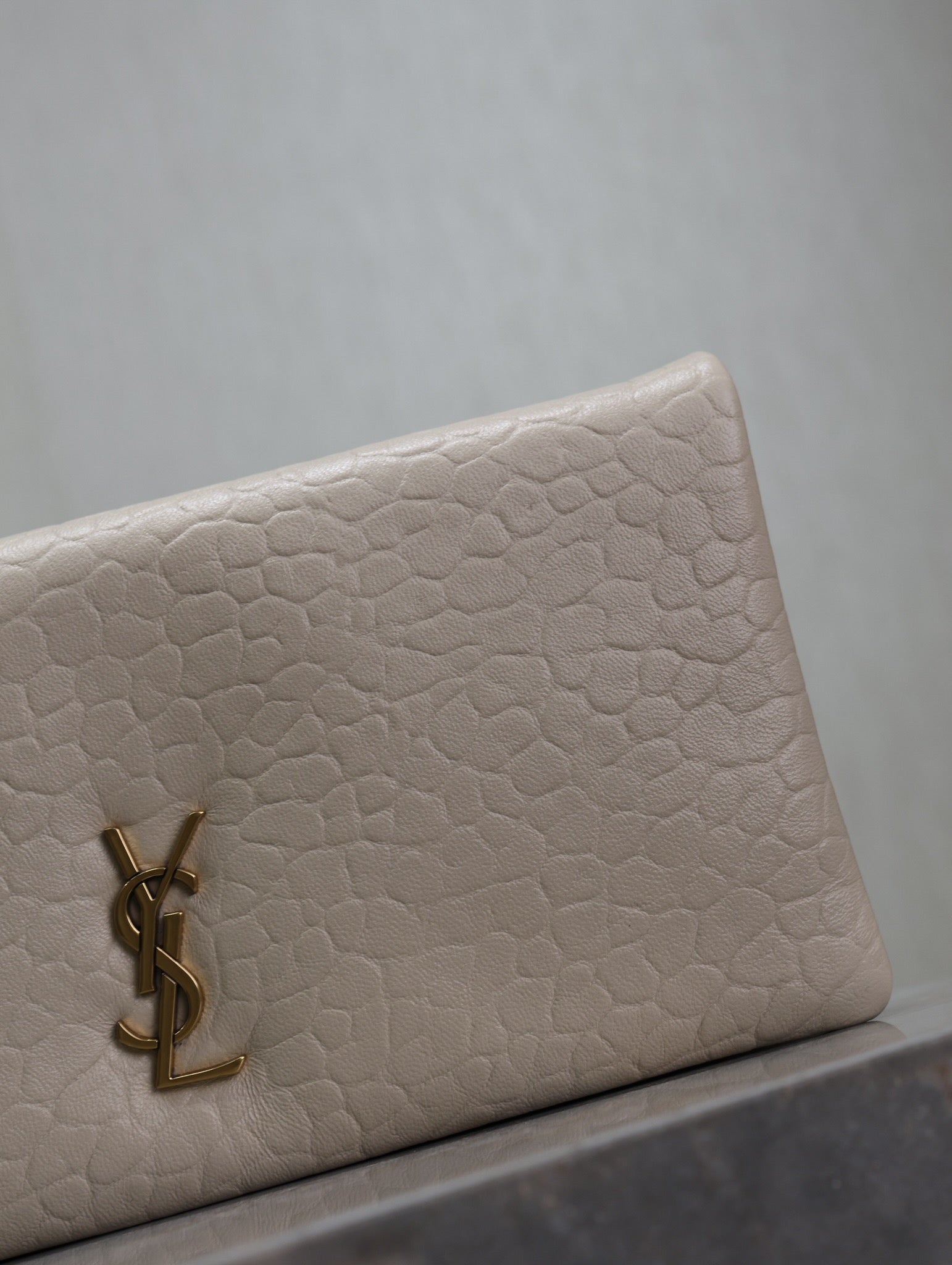 SAINT LAURENT CALYPSO POUCH 24 IN WHITE ELEPHANT TEXTURED LAMBSKIN GOLD LOGO