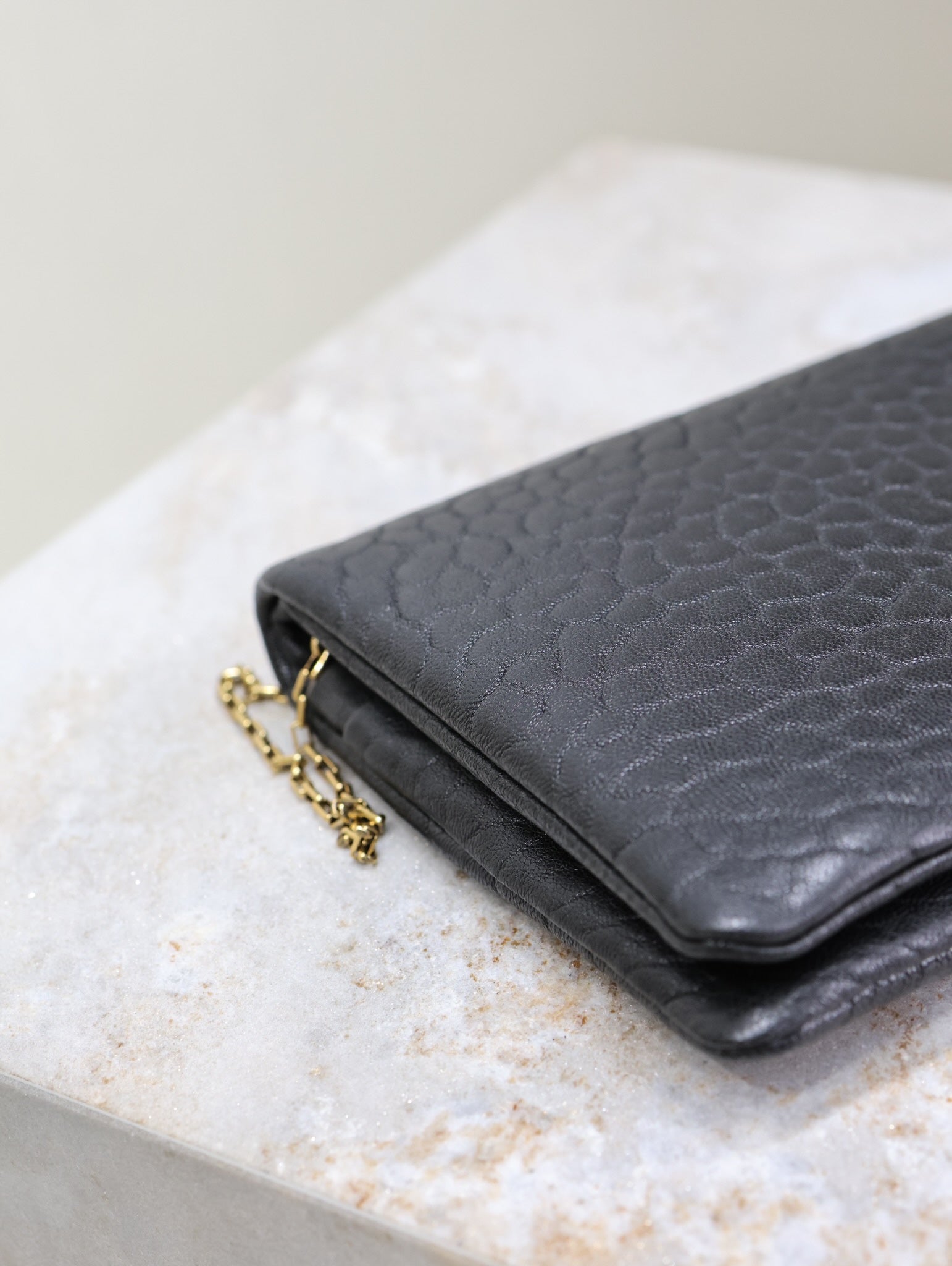 SAINT LAURENT CALYPSO POUCH 24 IN BLACK ELEPHANT TEXTURED LAMBSKIN GOLD LOGO