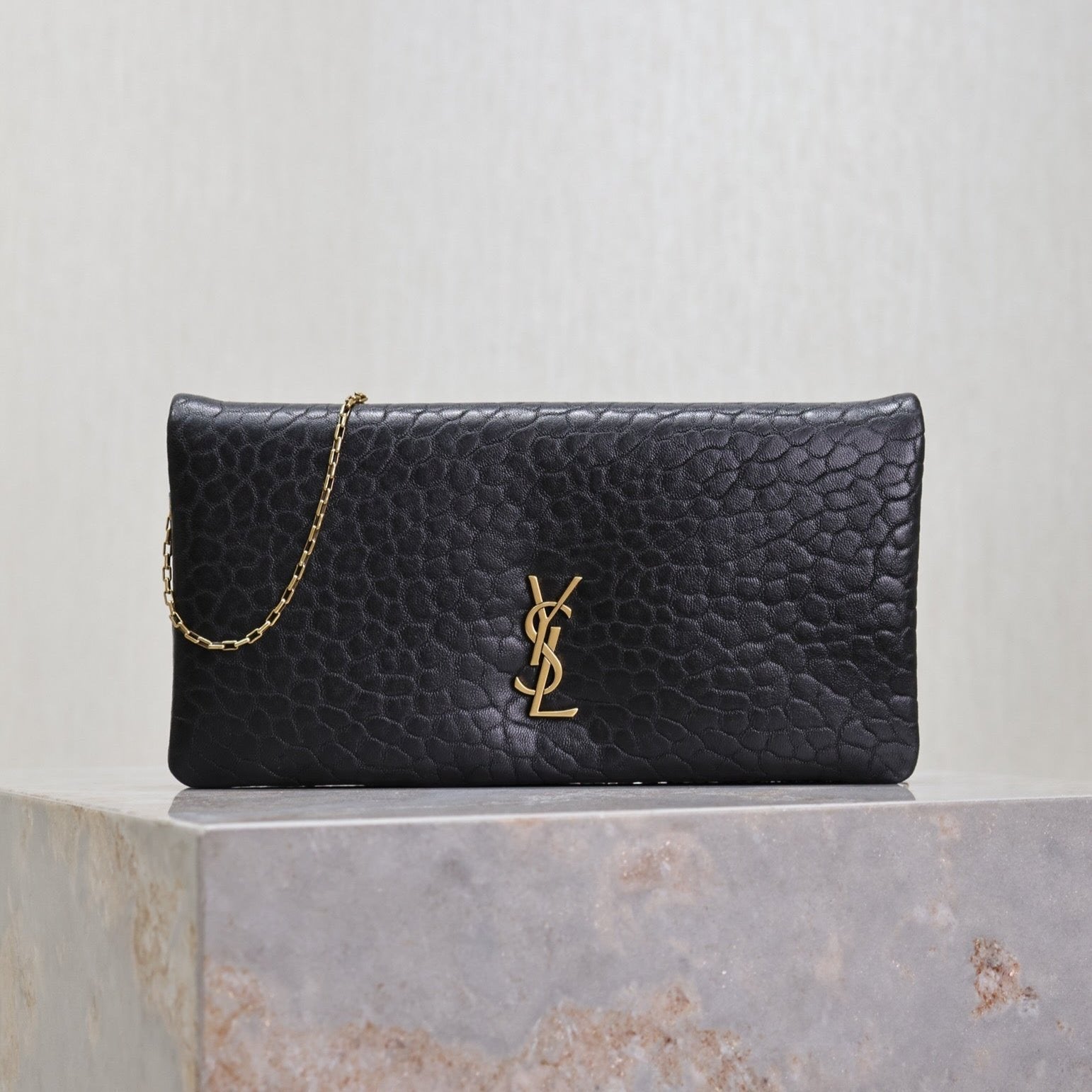 SAINT LAURENT CALYPSO POUCH 24 IN BLACK ELEPHANT TEXTURED LAMBSKIN GOLD LOGO