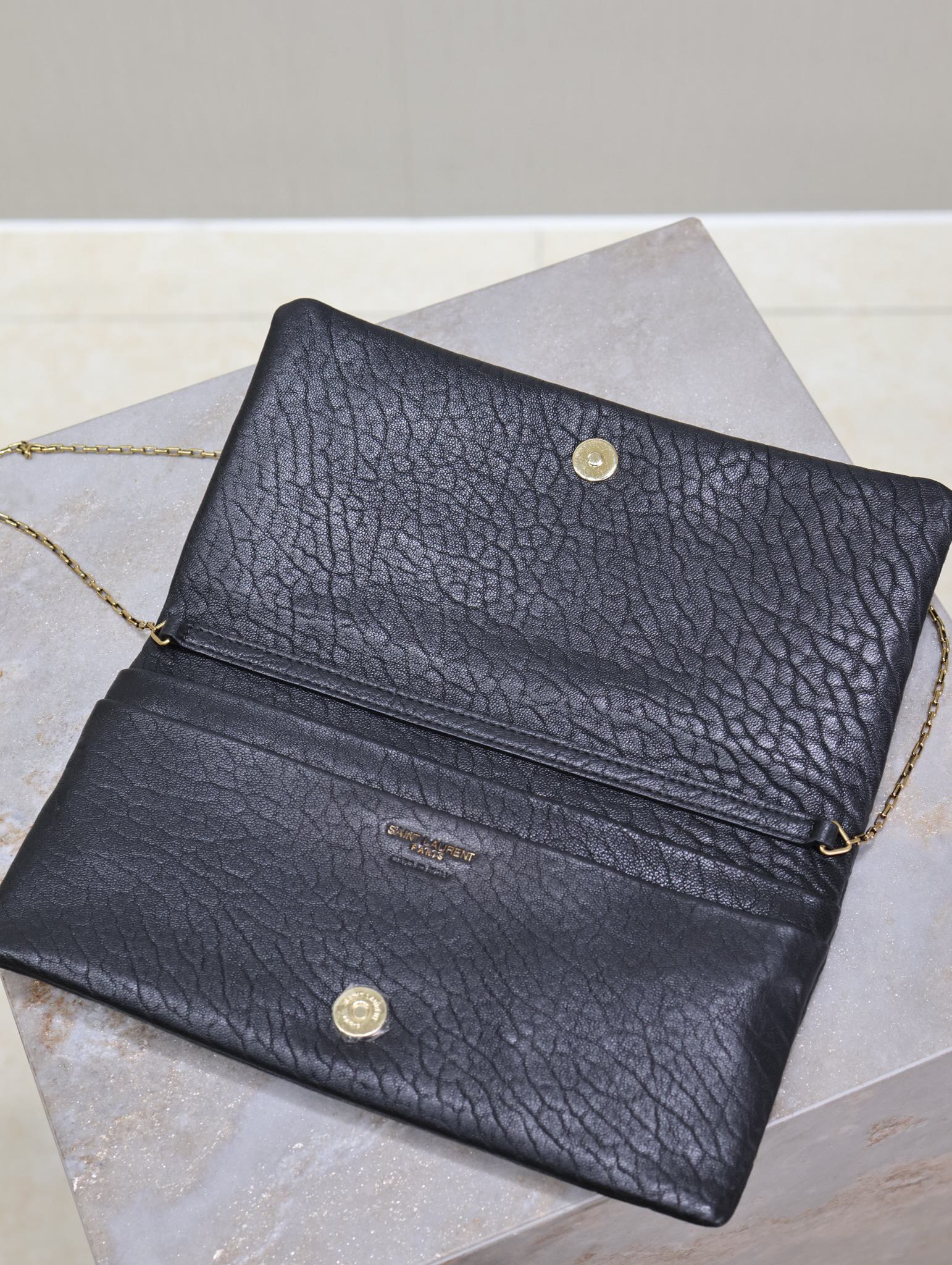 SAINT LAURENT CALYPSO POUCH 24 IN BLACK ELEPHANT TEXTURED LAMBSKIN GOLD LOGO