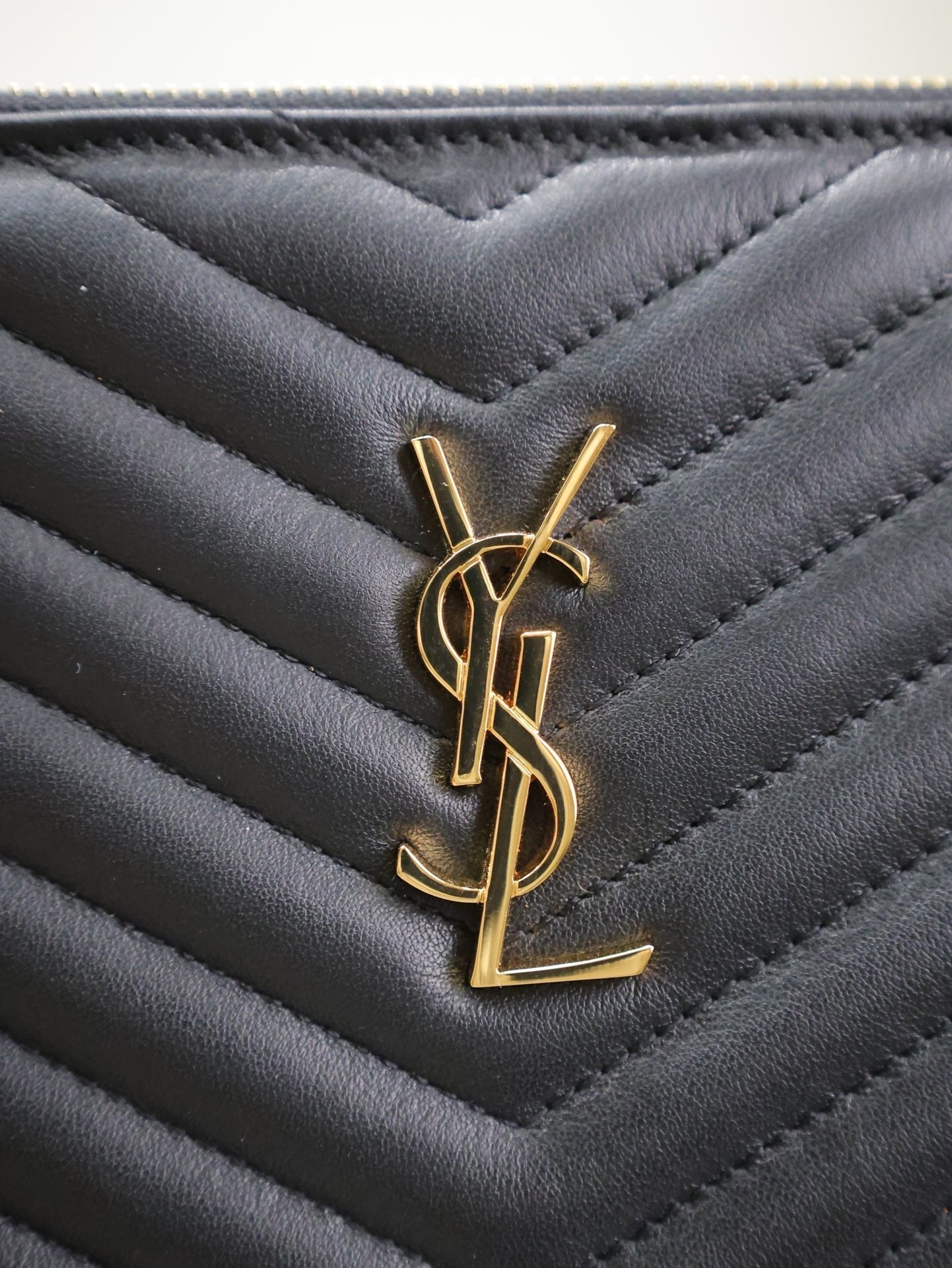 SAINT LAURENT CLUTCH 36 IN BLACK QUILTED CALFSKIN GOLD BUCKLE
