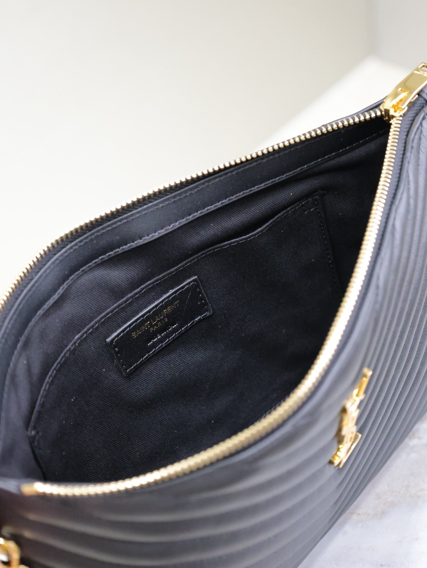 SAINT LAURENT CLUTCH 30 IN BLACK QUILTED CALFSKIN GOLD BUCKLE