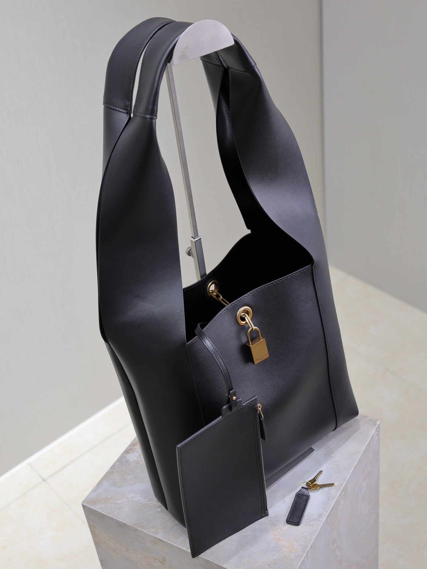 SAINT LAURENT TANGER HOBO BAG 27 IN BLACK CALFSKIN