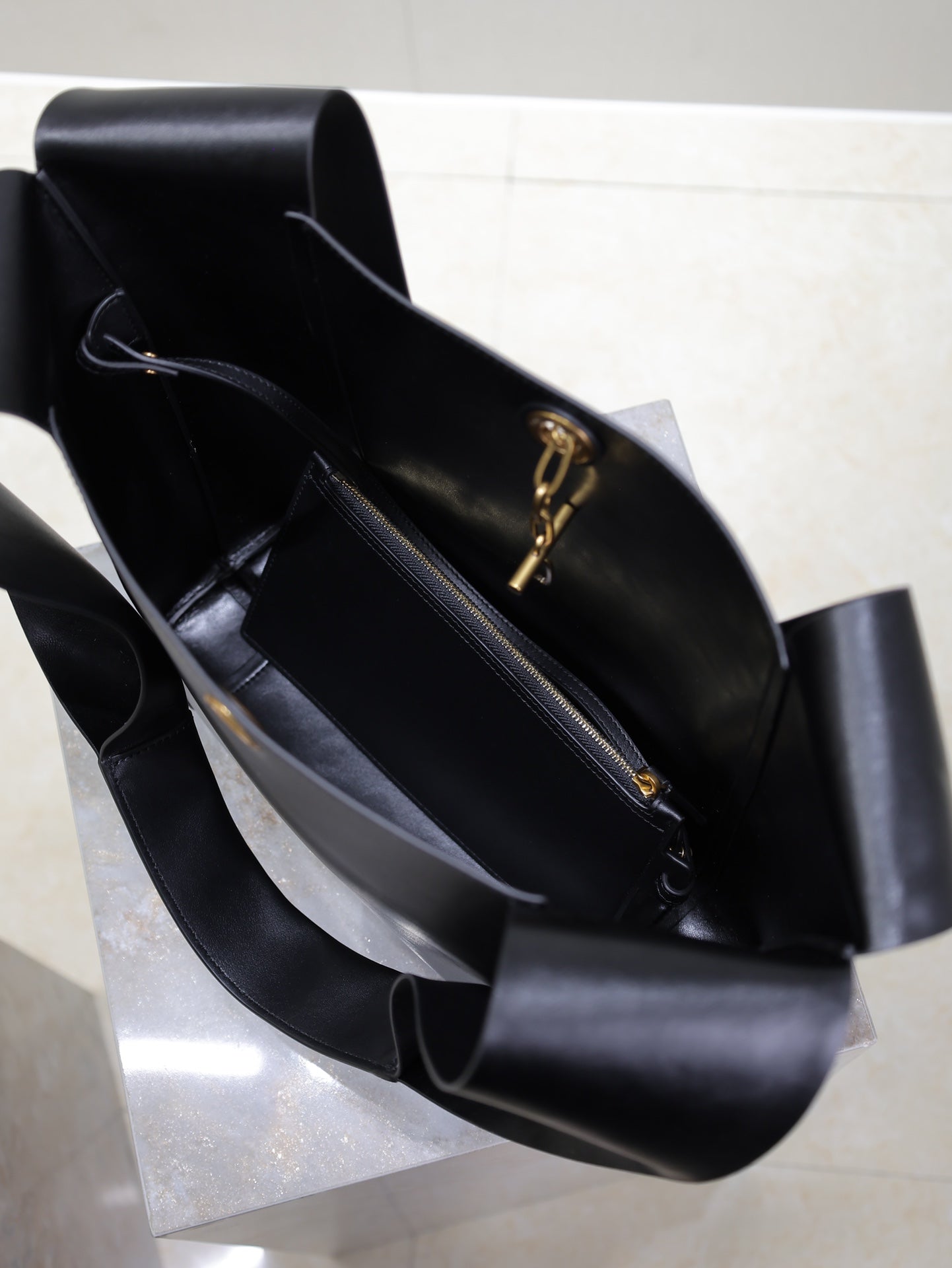 SAINT LAURENT TANGER HOBO BAG 27 IN BLACK CALFSKIN