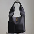 SAINT LAURENT TANGER HOBO BAG 27 IN BLACK CALFSKIN