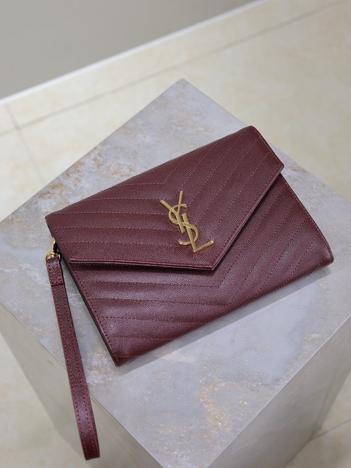 SAINT LAURENT CASSANDRE CLUTCH 21 IN BORDEAUX RED LAMBSKIN GOLD HARDWARE