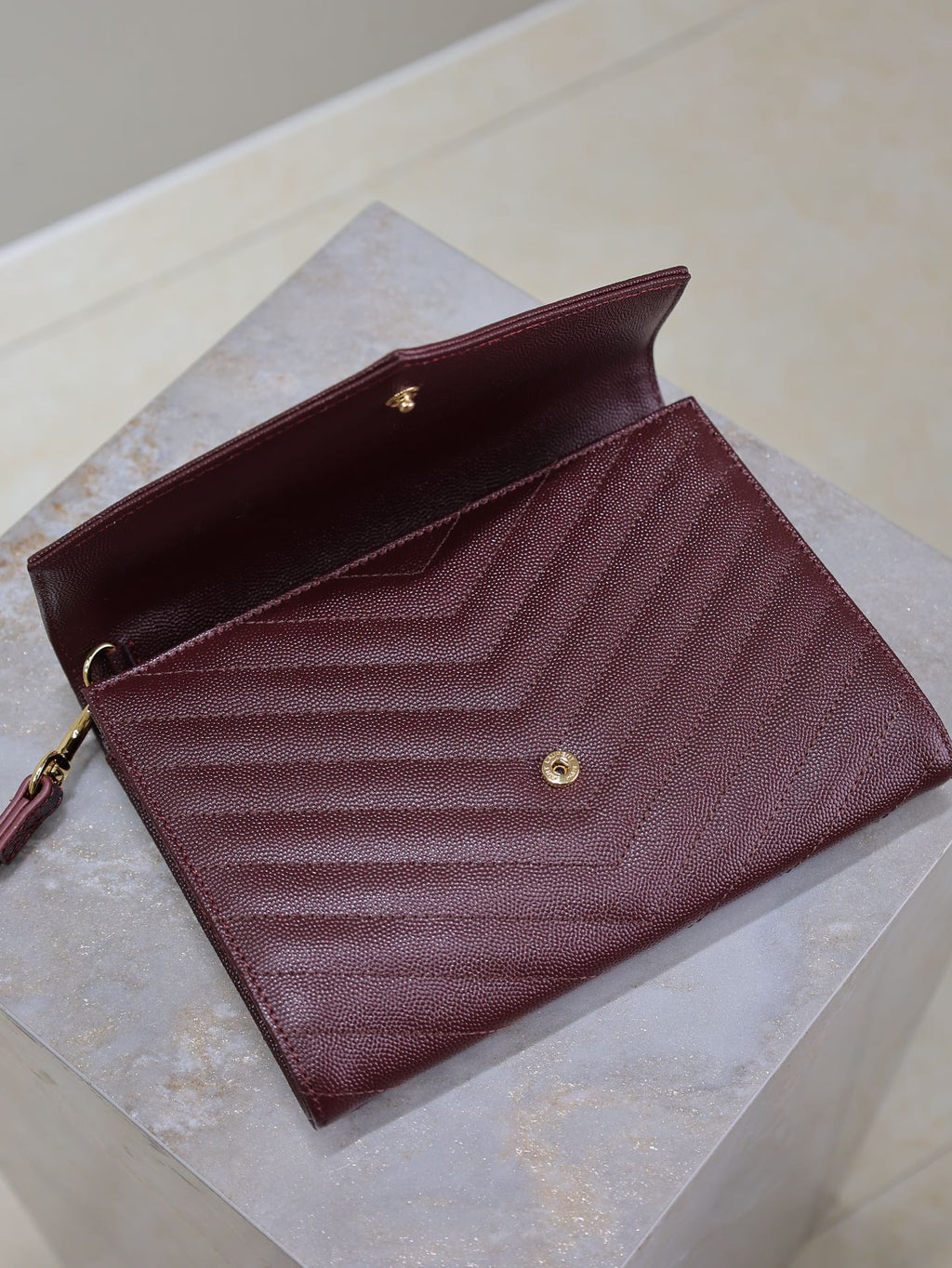 SAINT LAURENT CASSANDRE CLUTCH 21 IN BORDEAUX RED LAMBSKIN GOLD HARDWARE