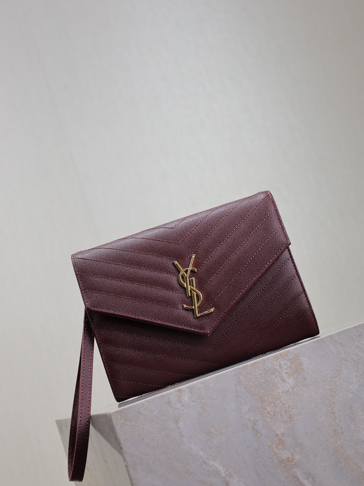 SAINT LAURENT CASSANDRE CLUTCH 21 IN BORDEAUX RED LAMBSKIN GOLD HARDWARE