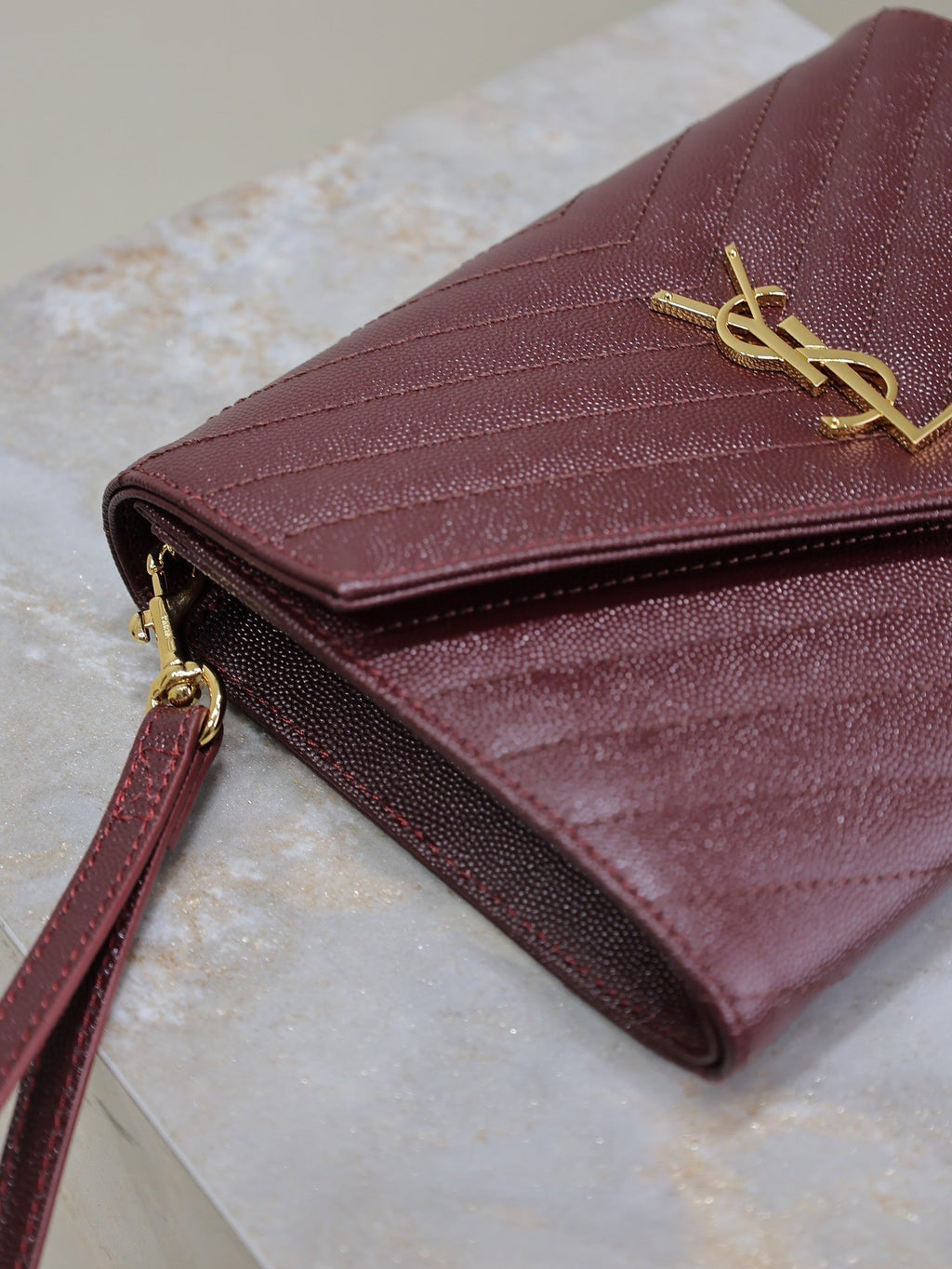 SAINT LAURENT CASSANDRE CLUTCH 21 IN BORDEAUX RED LAMBSKIN GOLD HARDWARE