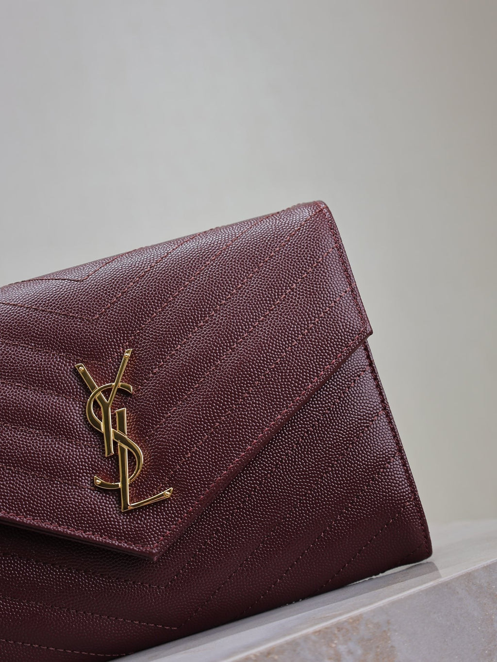 SAINT LAURENT CASSANDRE CLUTCH 21 IN BORDEAUX RED LAMBSKIN GOLD HARDWARE