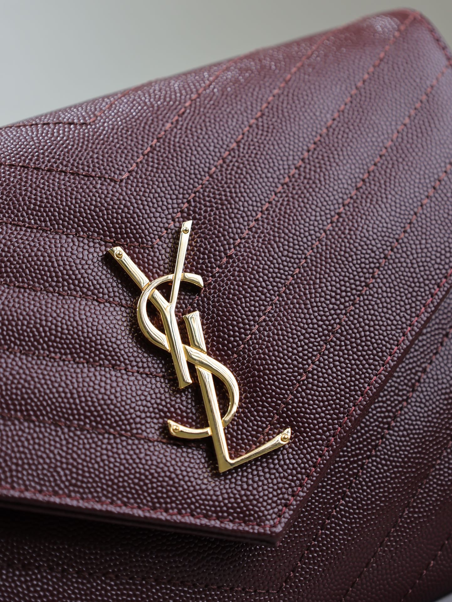 SAINT LAURENT CASSANDRE CLUTCH 21 IN BORDEAUX RED LAMBSKIN GOLD HARDWARE