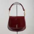 SAINT LAURENT VOLTAIRE SADDLE BAG 21 IN BORDEAUX RED PATENT CALFSKIN