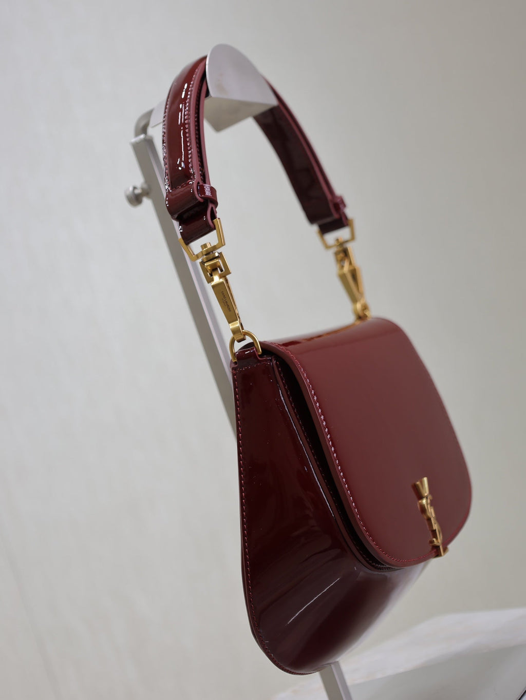SAINT LAURENT VOLTAIRE SADDLE BAG 21 IN BORDEAUX RED PATENT CALFSKIN