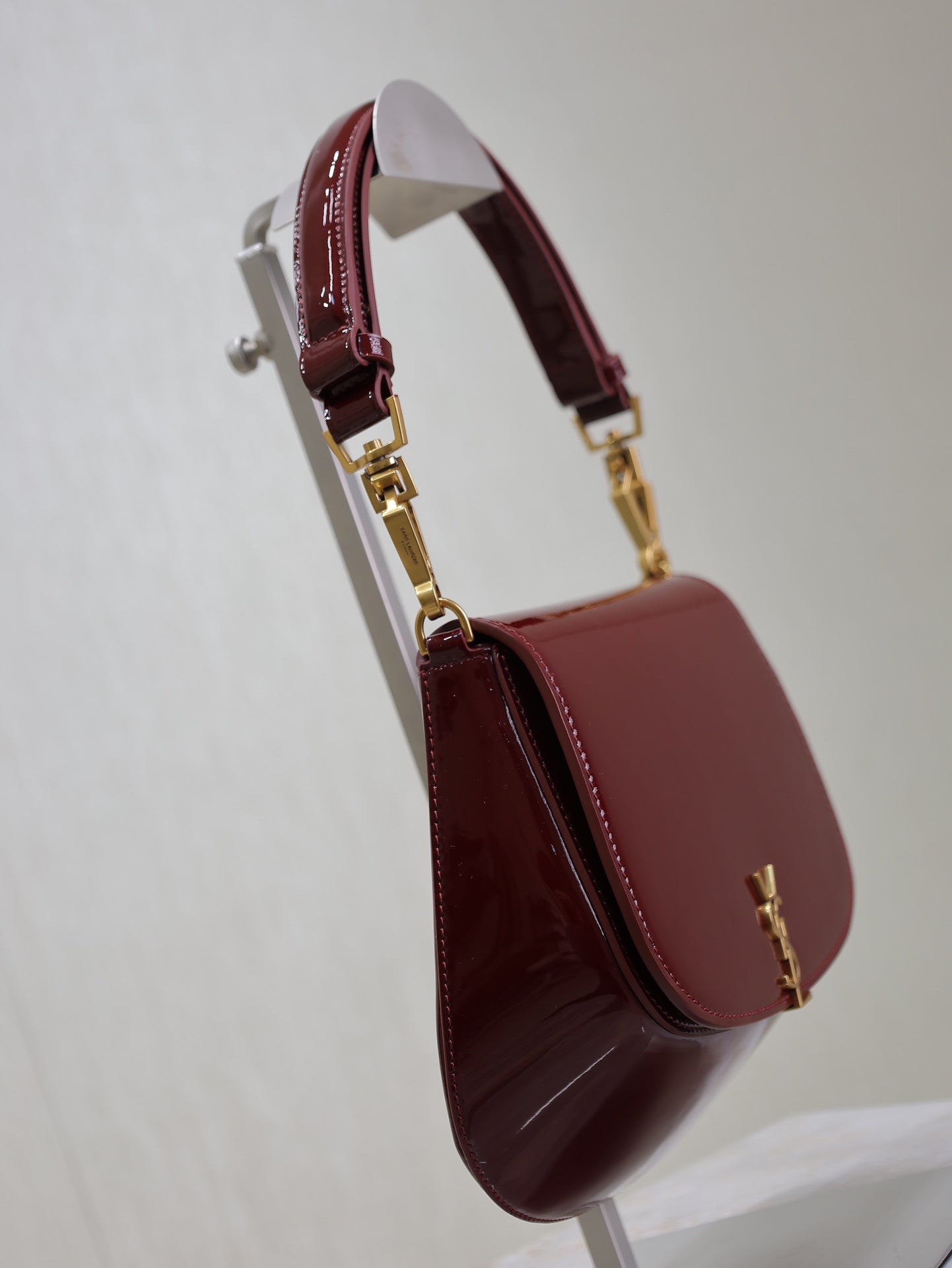 SAINT LAURENT VOLTAIRE SADDLE BAG 21 IN BORDEAUX RED PATENT CALFSKIN
