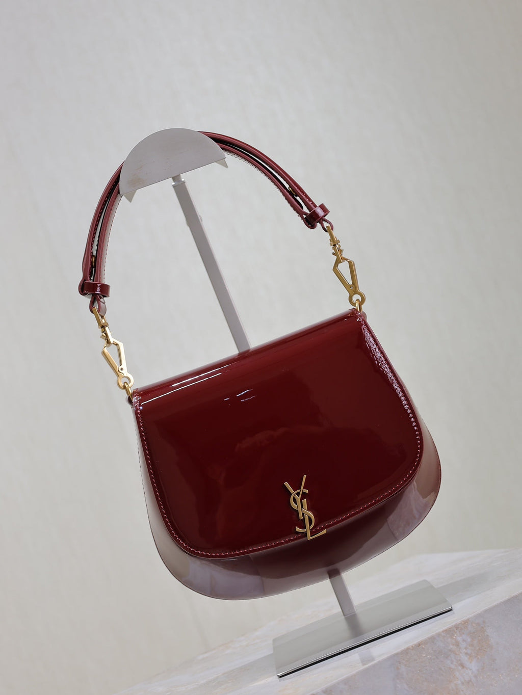 SAINT LAURENT VOLTAIRE SADDLE BAG 21 IN BORDEAUX RED PATENT CALFSKIN