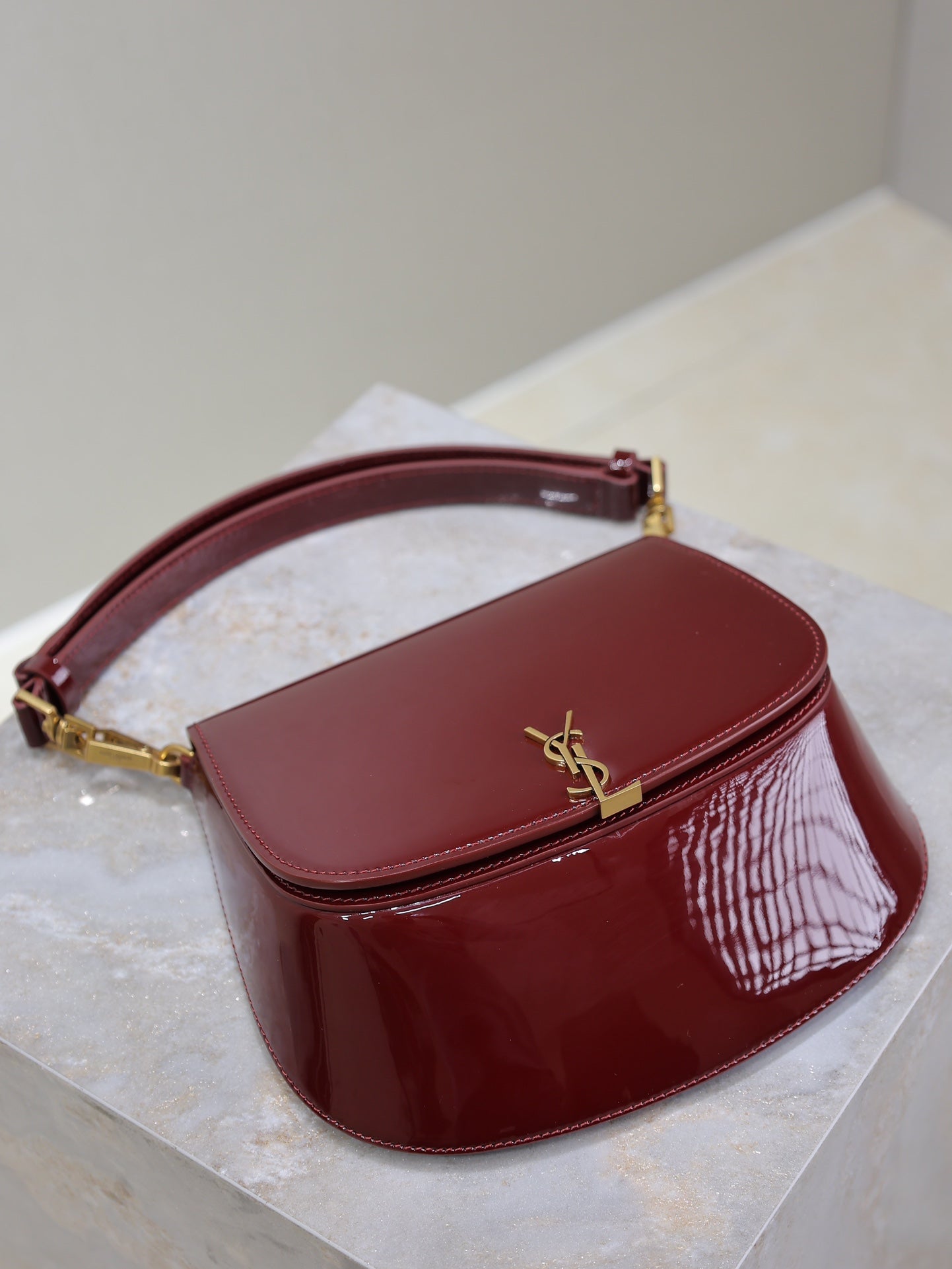 SAINT LAURENT VOLTAIRE SADDLE BAG 21 IN BORDEAUX RED PATENT CALFSKIN