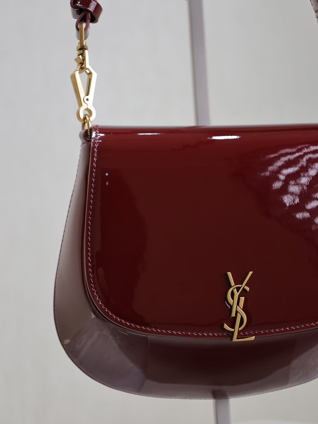SAINT LAURENT VOLTAIRE SADDLE BAG 21 IN BORDEAUX RED PATENT CALFSKIN