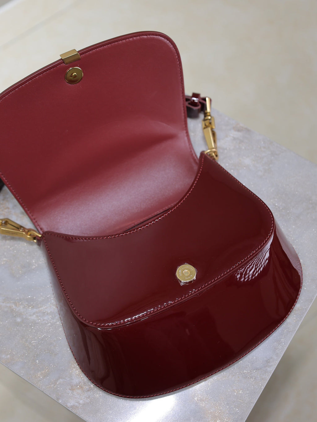 SAINT LAURENT VOLTAIRE SADDLE BAG 21 IN BORDEAUX RED PATENT CALFSKIN