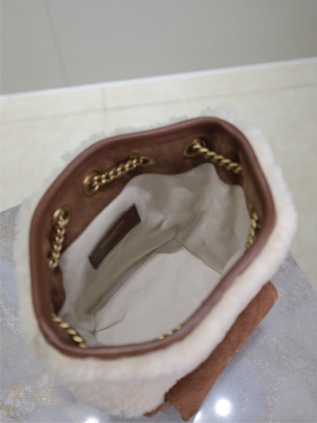 SAINT LAURENT JOE MINI BUCKET BAG 19 IN WHITE SHEARLING AND BROWN SUEDE